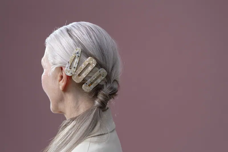 Silver hair and pearl clips in profile