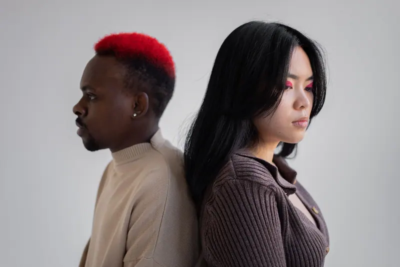 Red crop and long black hair, back to back