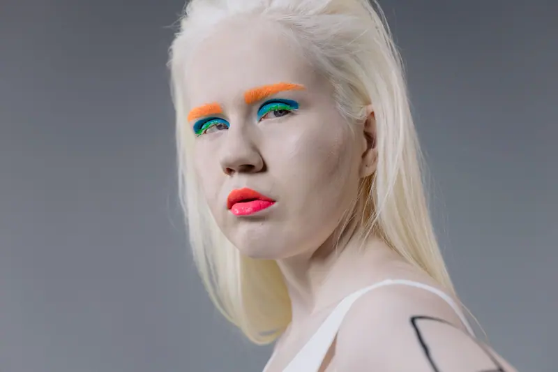 Platinum hair and neon makeup