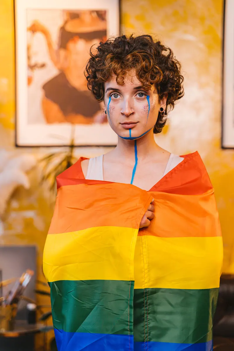 Rainbow flag and blue body paint