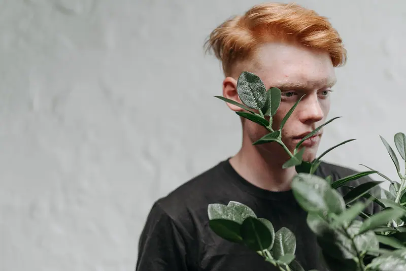 Man with copper hair in a relaxed portrait